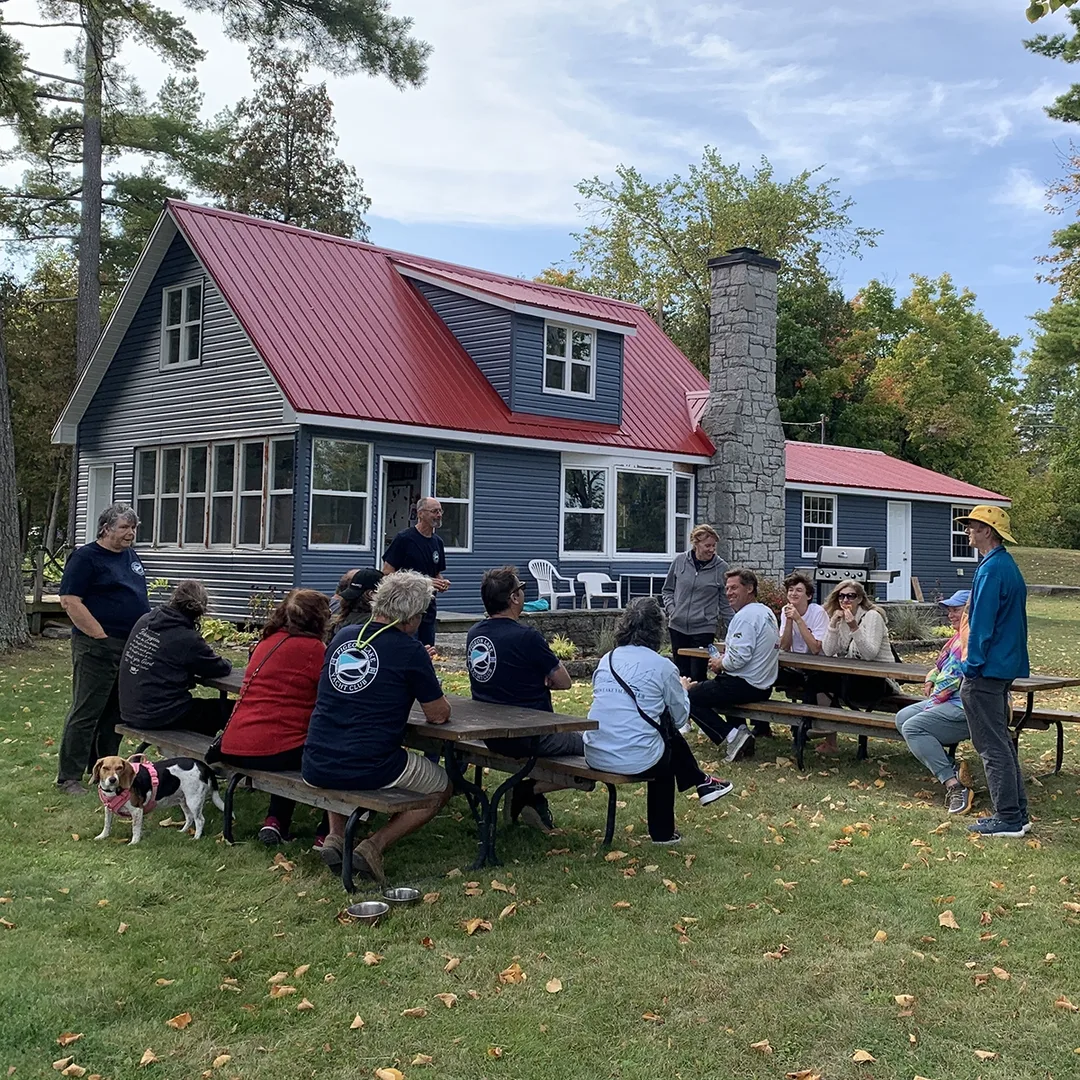 People gathered on the lawn at the clubhouse